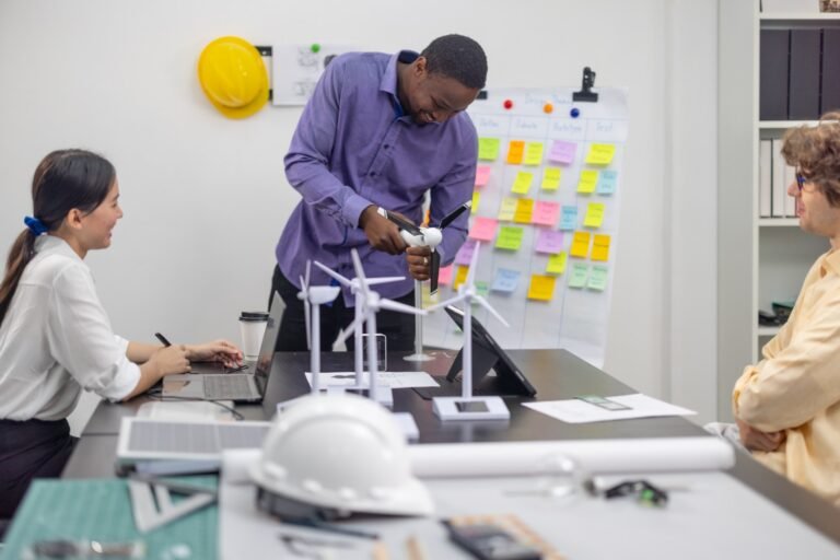 A diverse startup team develop, collaborates on a powerful, lightweight, portable wind turbine prototype, aligning with potential user demand and renewable energy needs to secure investor funding.